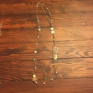 Gold long chain necklace.